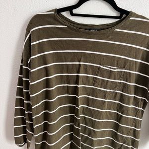 A super cute green and white striped shirt with half length sleeves.